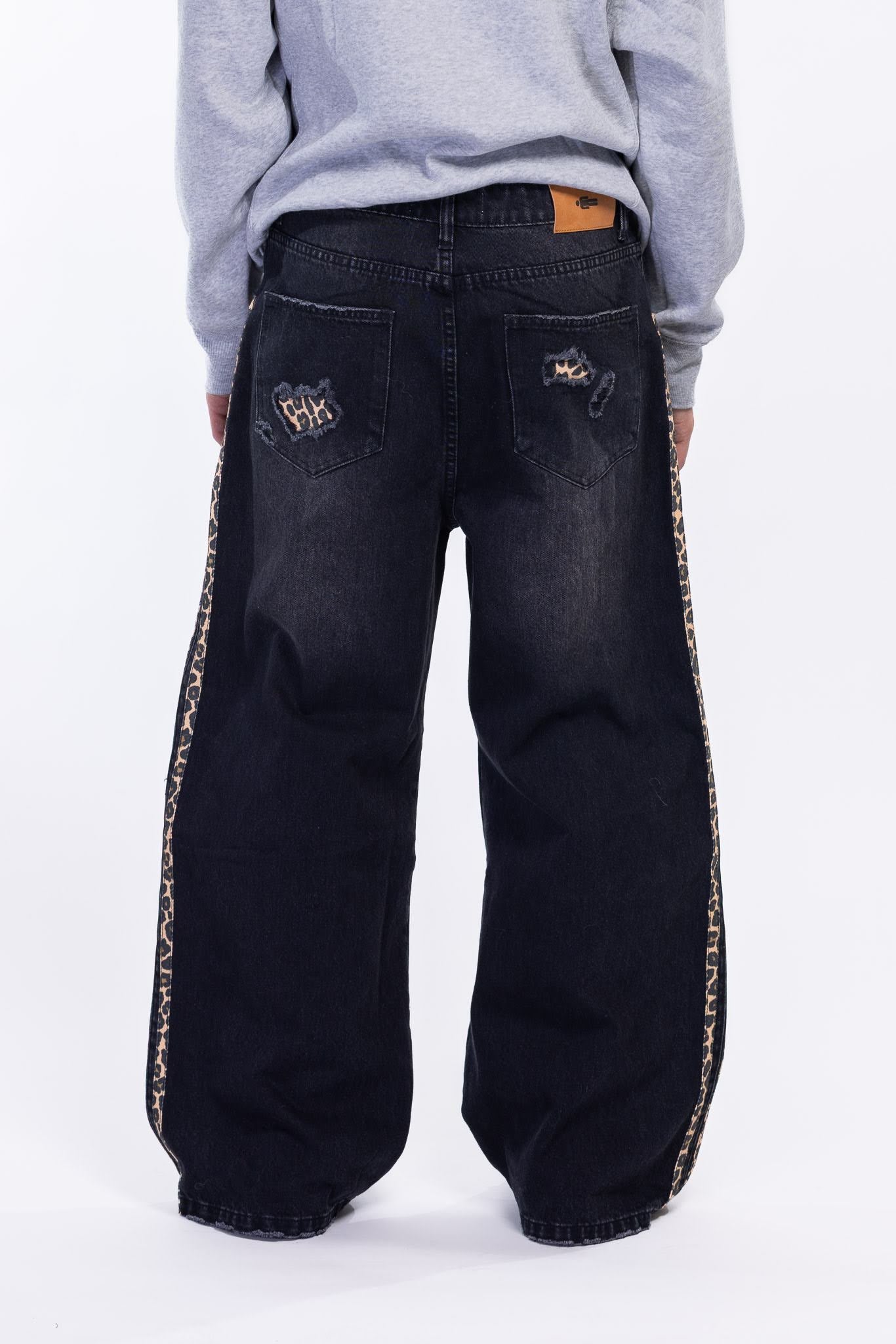 Black distressed jeans with leopard side panels 