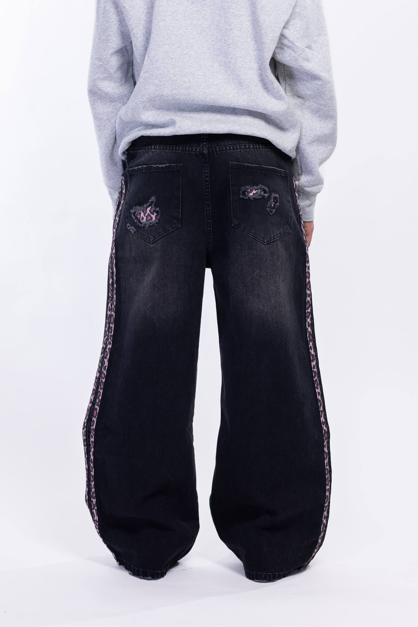 Black distressed jeans with pink leopard side panels 