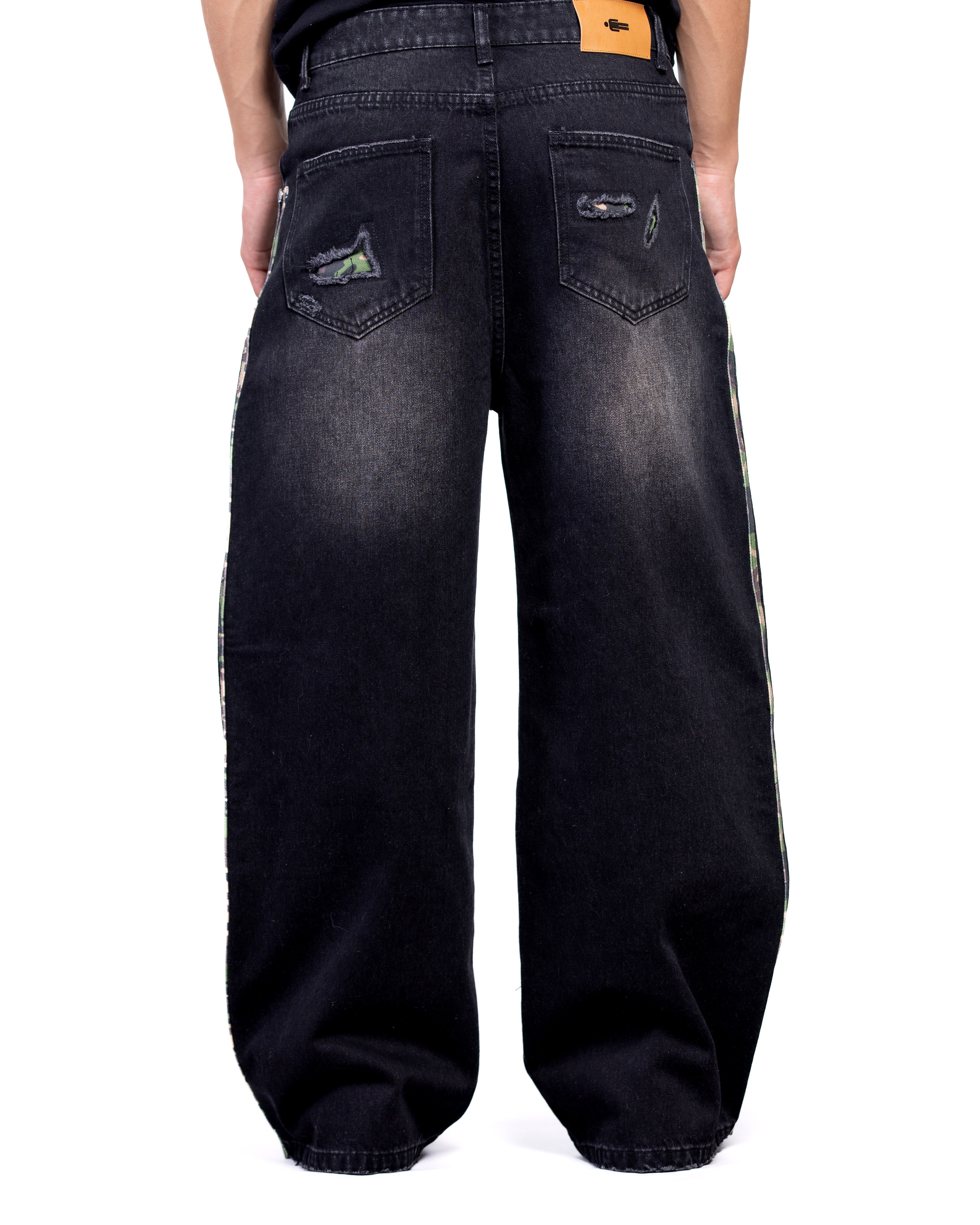 Black wide-leg jeans with distressed details on a white background