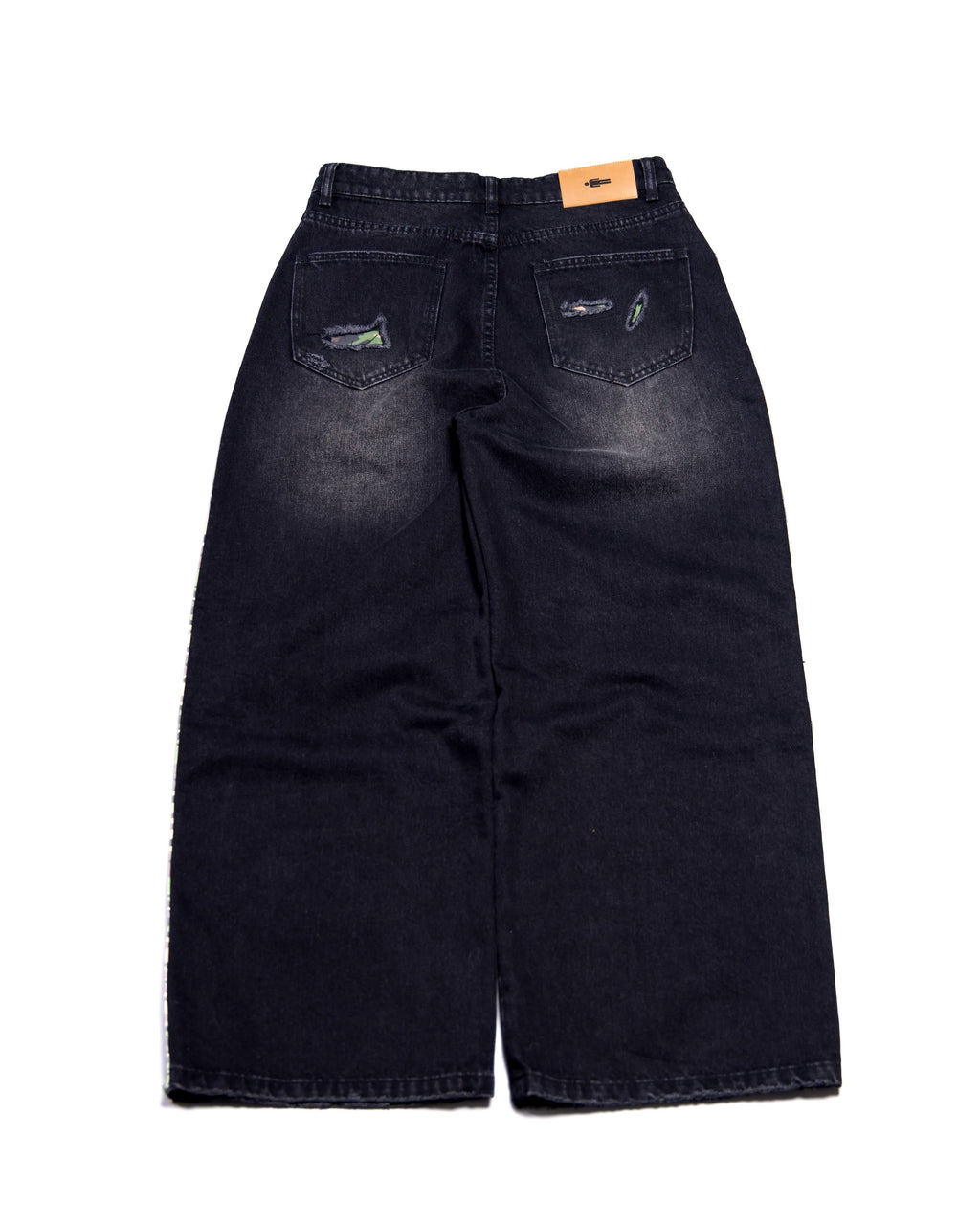 Black distressed jeans on a white background