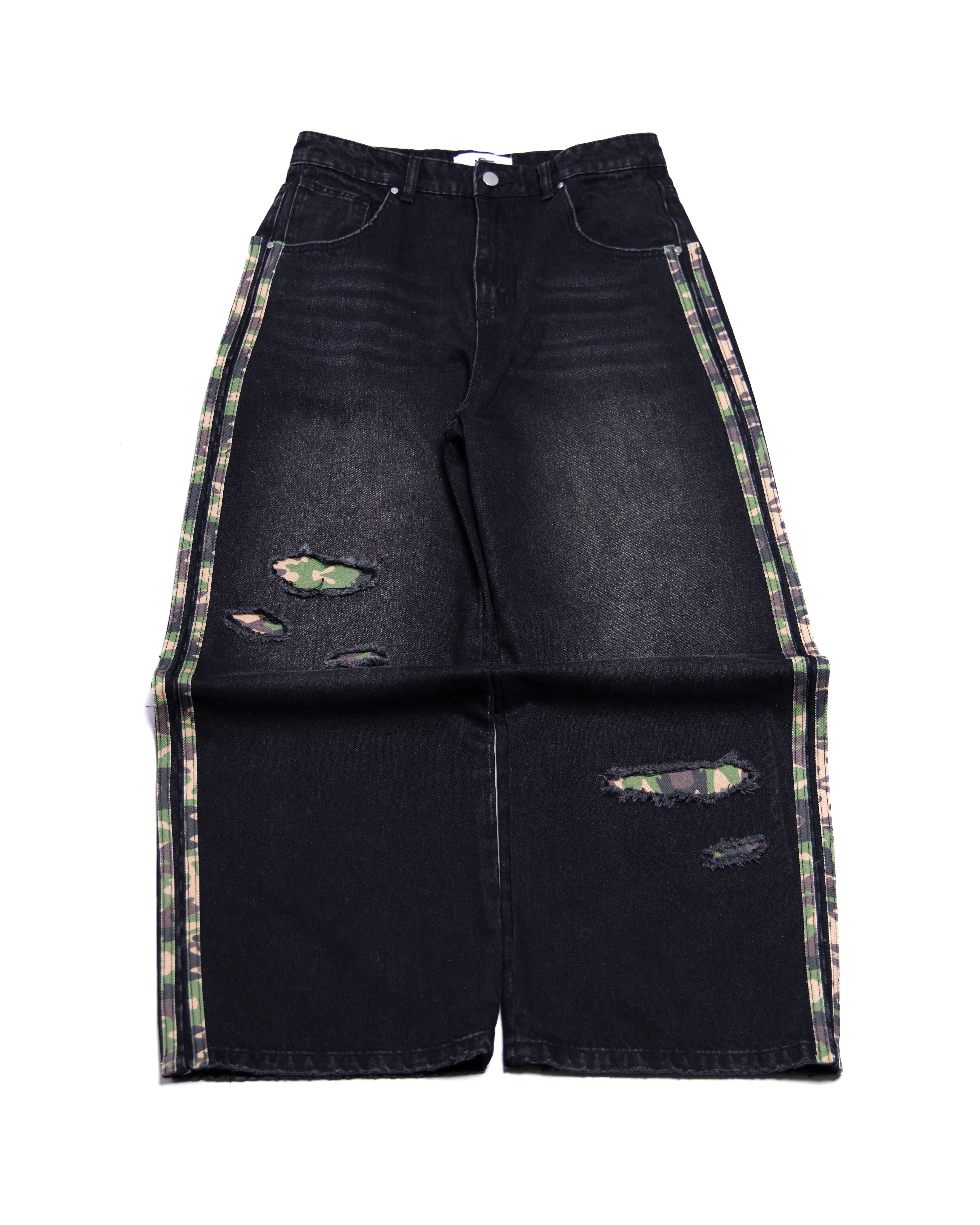 Black distressed denim jeans with camo accents on a white background