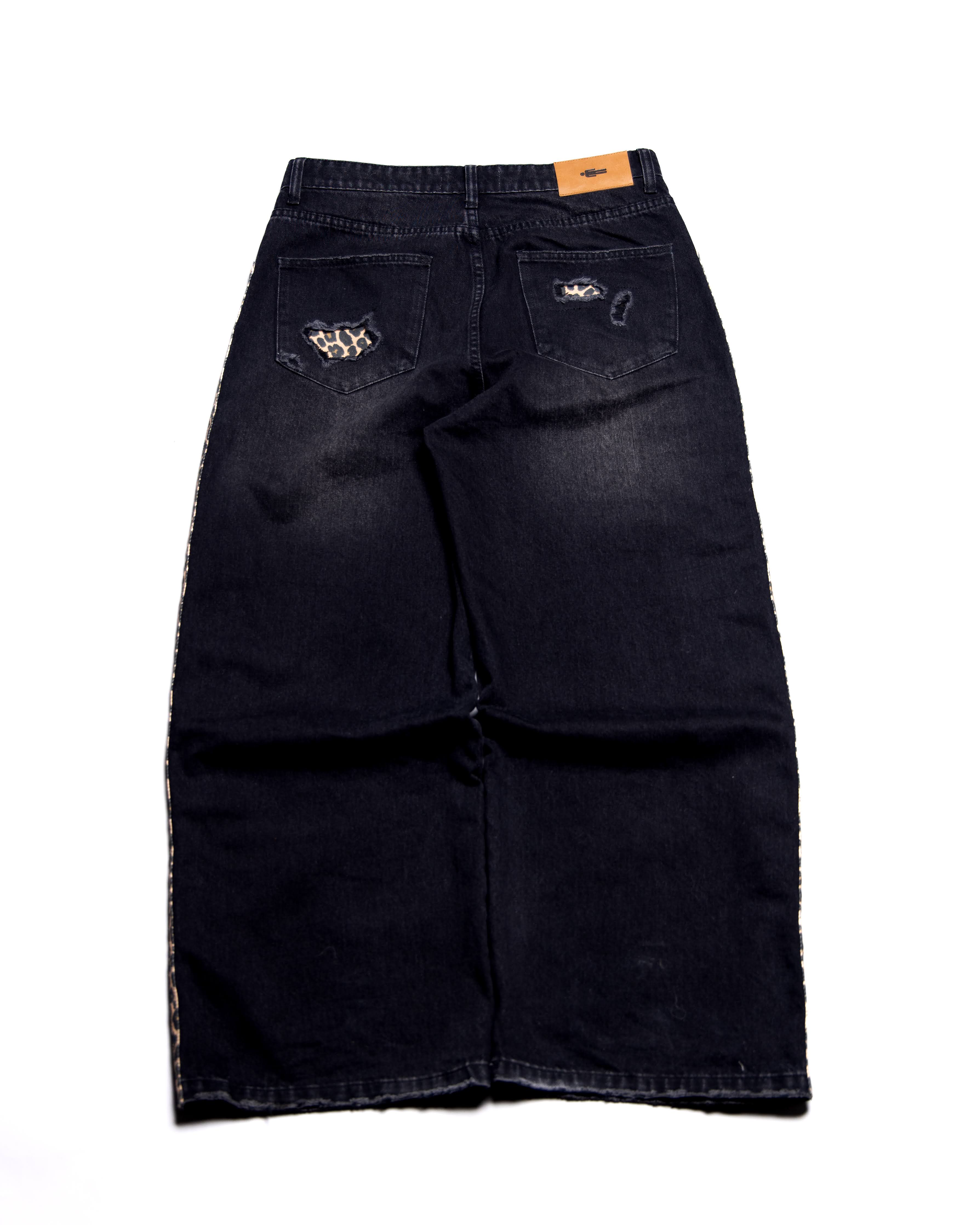 Black denim jeans with brand logo on a white background