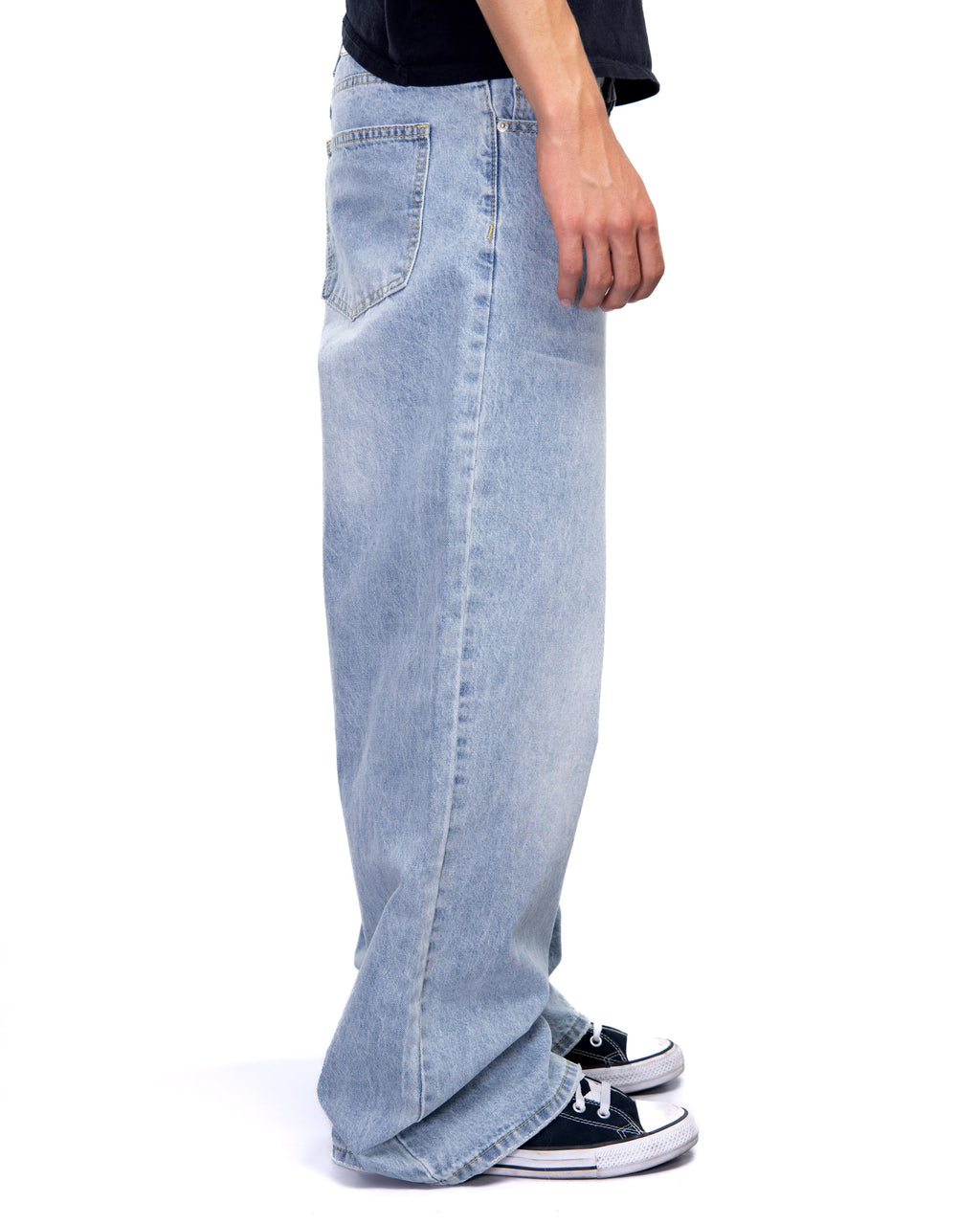 Light blue jeans worn by a person on a white background