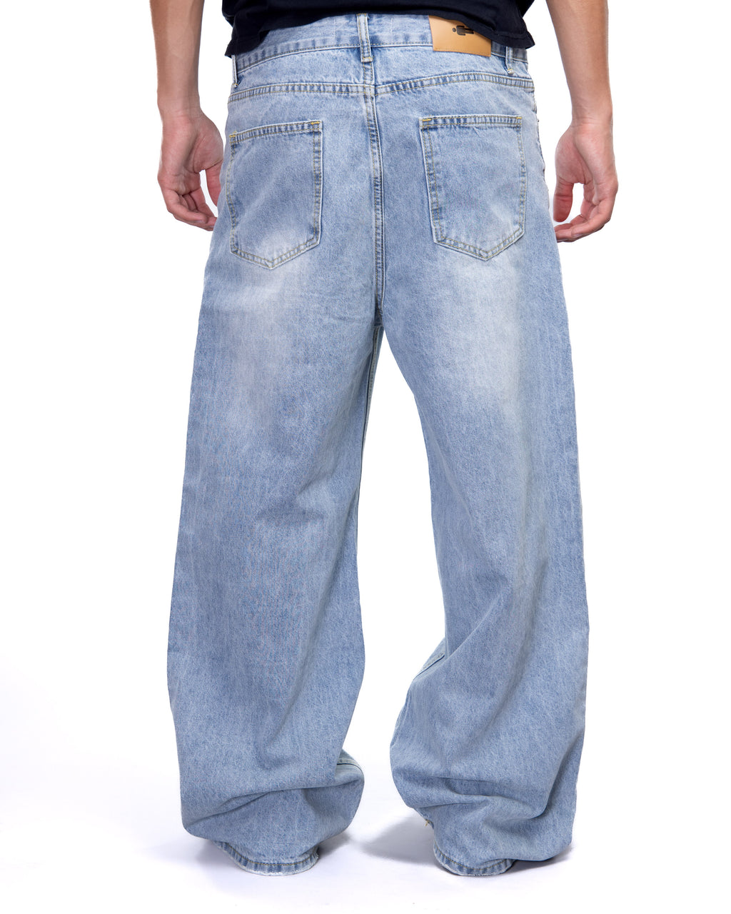 Light blue wide-leg jeans worn by a person on a white background