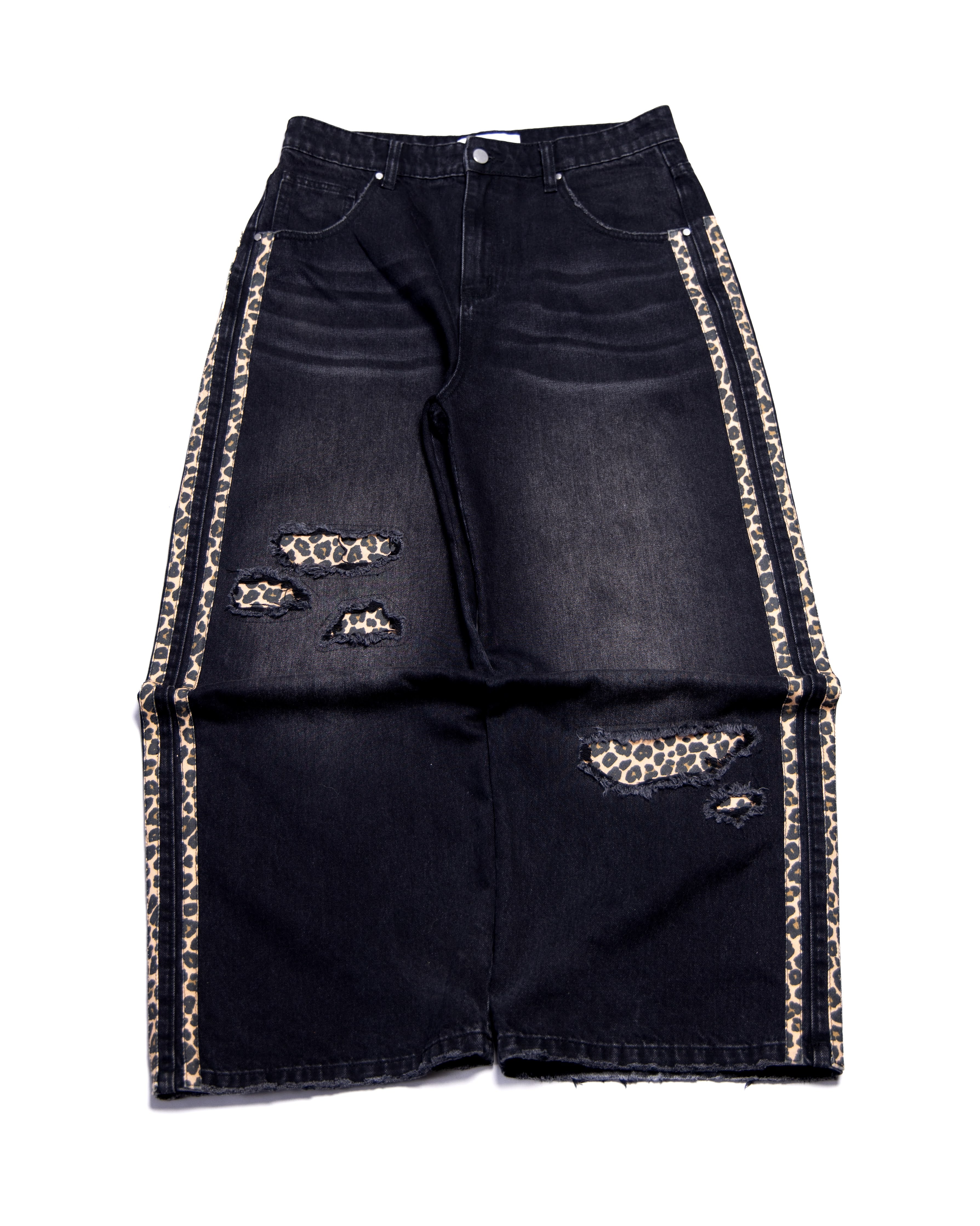 Black denim jeans with leopard print accents on a white background